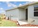 Side yard with a door leading inside the home at 16926 Harvest Moon Way, Bradenton, FL 34211