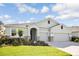 One-story house with a two-car garage and attractive landscaping at 16926 Harvest Moon Way, Bradenton, FL 34211