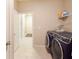 Bright laundry room with washer, dryer, and ample shelving at 16926 Harvest Moon Way, Bradenton, FL 34211