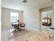 Bright dining room with wood table and four chairs, near the kitchen at 16926 Harvest Moon Way, Bradenton, FL 34211