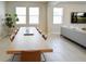 Spacious dining area with a long wooden table and six chairs at 16926 Harvest Moon Way, Bradenton, FL 34211