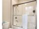 Bathroom with shower/tub combo, and a frameless glass shower door at 16926 Harvest Moon Way, Bradenton, FL 34211