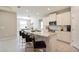 Modern kitchen featuring granite countertops, white cabinets, and stainless steel appliances at 16926 Harvest Moon Way, Bradenton, FL 34211
