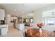Open kitchen with breakfast nook, stainless steel appliances and view of backyard at 16926 Harvest Moon Way, Bradenton, FL 34211