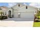 New construction home with two-car garage and landscaping at 16926 Harvest Moon Way, Bradenton, FL 34211