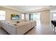 Spacious living area with sectional sofa and access to backyard patio at 16926 Harvest Moon Way, Bradenton, FL 34211
