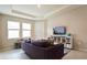 Cozy living room featuring a comfortable couch and built-in shelving at 16926 Harvest Moon Way, Bradenton, FL 34211