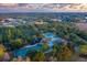 Aerial view of community amenities including playground, tennis, and basketball courts at 22605 Night Heron Way, Bradenton, FL 34202