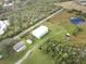 Aerial view of additional buildings on the property at 31730 Clay Gully Rd, Myakka City, FL 34251