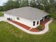 Birds eye view of backyard featuring a screened patio, mature landscaping, and backyard entertaining spaces at 31730 Clay Gully Rd, Myakka City, FL 34251