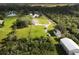 Aerial view of a home with barn and large lot at 31730 Clay Gully Rd, Myakka City, FL 34251