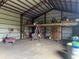 Spacious barn interior with a loft and storage at 31730 Clay Gully Rd, Myakka City, FL 34251