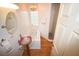 Small bathroom with a soaking tub, glass block window and updated sink at 31730 Clay Gully Rd, Myakka City, FL 34251