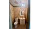 Small bathroom with updated vanity and flooring at 31730 Clay Gully Rd, Myakka City, FL 34251