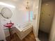 Small bathroom with a soaking tub and a separate shower at 31730 Clay Gully Rd, Myakka City, FL 34251
