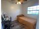 Small bedroom with a single bed, workspace, and light flooring at 31730 Clay Gully Rd, Myakka City, FL 34251