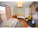 Cozy bedroom with two twin beds and a nature-themed wall at 31730 Clay Gully Rd, Myakka City, FL 34251