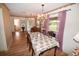 Elegant dining room with chandelier, hardwood floors, and view to backyard at 31730 Clay Gully Rd, Myakka City, FL 34251