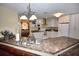 Open kitchen with an island and stainless steel appliances at 31730 Clay Gully Rd, Myakka City, FL 34251