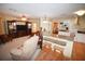 Open kitchen and living area with island and breakfast bar at 31730 Clay Gully Rd, Myakka City, FL 34251