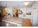 Bright kitchen with white cabinets, granite countertops, and hardwood floors at 31730 Clay Gully Rd, Myakka City, FL 34251