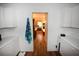 Bright laundry room with washer, dryer, and extra storage at 31730 Clay Gully Rd, Myakka City, FL 34251