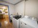 Laundry room with washer, dryer, and utility sink at 31730 Clay Gully Rd, Myakka City, FL 34251