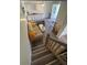 Open living area with stairs leading upstairs, simple decor at 31730 Clay Gully Rd, Myakka City, FL 34251