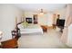 Large main bedroom with king bed, fireplace, and access to bath at 31730 Clay Gully Rd, Myakka City, FL 34251