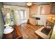 Home office with built in cabinets and access to a screened porch at 31730 Clay Gully Rd, Myakka City, FL 34251