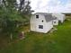 Exterior view of a light beige barn-style outbuilding at 31730 Clay Gully Rd, Myakka City, FL 34251