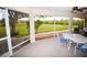 Relaxing screened porch with outdoor furniture at 31730 Clay Gully Rd, Myakka City, FL 34251