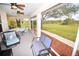 Screened porch with seating and view of yard at 31730 Clay Gully Rd, Myakka City, FL 34251