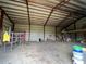 Large open workshop with high ceilings and ample storage at 31730 Clay Gully Rd, Myakka City, FL 34251