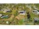 Aerial view showing home, pool, and large lot with storage space at 321 Hills Rd, Nokomis, FL 34275