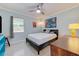 Spacious bedroom with light blue walls and a gray platform bed at 321 Hills Rd, Nokomis, FL 34275