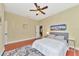 Well-lit guest bedroom with hardwood floors and artwork at 3970 Serenity Cir, Sarasota, FL 34235
