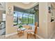 Cozy sitting area with a comfortable chair and large window at 3970 Serenity Cir, Sarasota, FL 34235