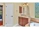Primary bathroom with a vanity, walk-in shower and access to a bedroom at 3970 Serenity Cir, Sarasota, FL 34235