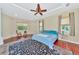 Spacious Primary bedroom with hardwood floors and ceiling fan at 3970 Serenity Cir, Sarasota, FL 34235