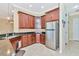 Kitchen features stainless steel appliances and dark wood cabinets at 3970 Serenity Cir, Sarasota, FL 34235