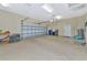 Spacious two-car garage with built-in shelving and ample storage space at 3970 Serenity Cir, Sarasota, FL 34235