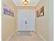Bright and spacious entryway with double doors and artwork at 3970 Serenity Cir, Sarasota, FL 34235