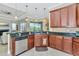 Open concept kitchen with granite countertops and stainless steel appliances at 3970 Serenity Cir, Sarasota, FL 34235