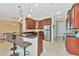Modern kitchen with stainless steel appliances and an island with seating at 3970 Serenity Cir, Sarasota, FL 34235