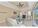 Relaxing living room with a fireplace and plenty of natural light at 3970 Serenity Cir, Sarasota, FL 34235