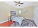 Guest bedroom with a queen-size bed and ceiling fan at 3970 Serenity Cir, Sarasota, FL 34235