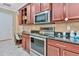 Well-equipped kitchen with stainless steel appliances and granite countertops at 3970 Serenity Cir, Sarasota, FL 34235