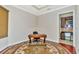 Home office with built-in shelving and a large window at 3970 Serenity Cir, Sarasota, FL 34235
