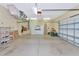 Garage with ample storage space and an overhead door at 3970 Serenity Cir, Sarasota, FL 34235
